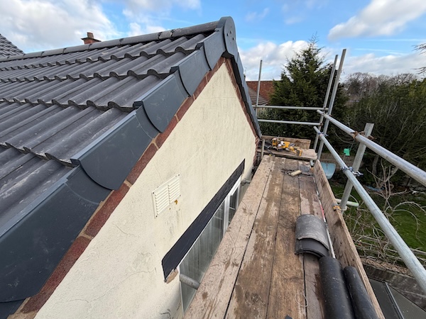 Finished roofing project with new tiles in West Yorkshire